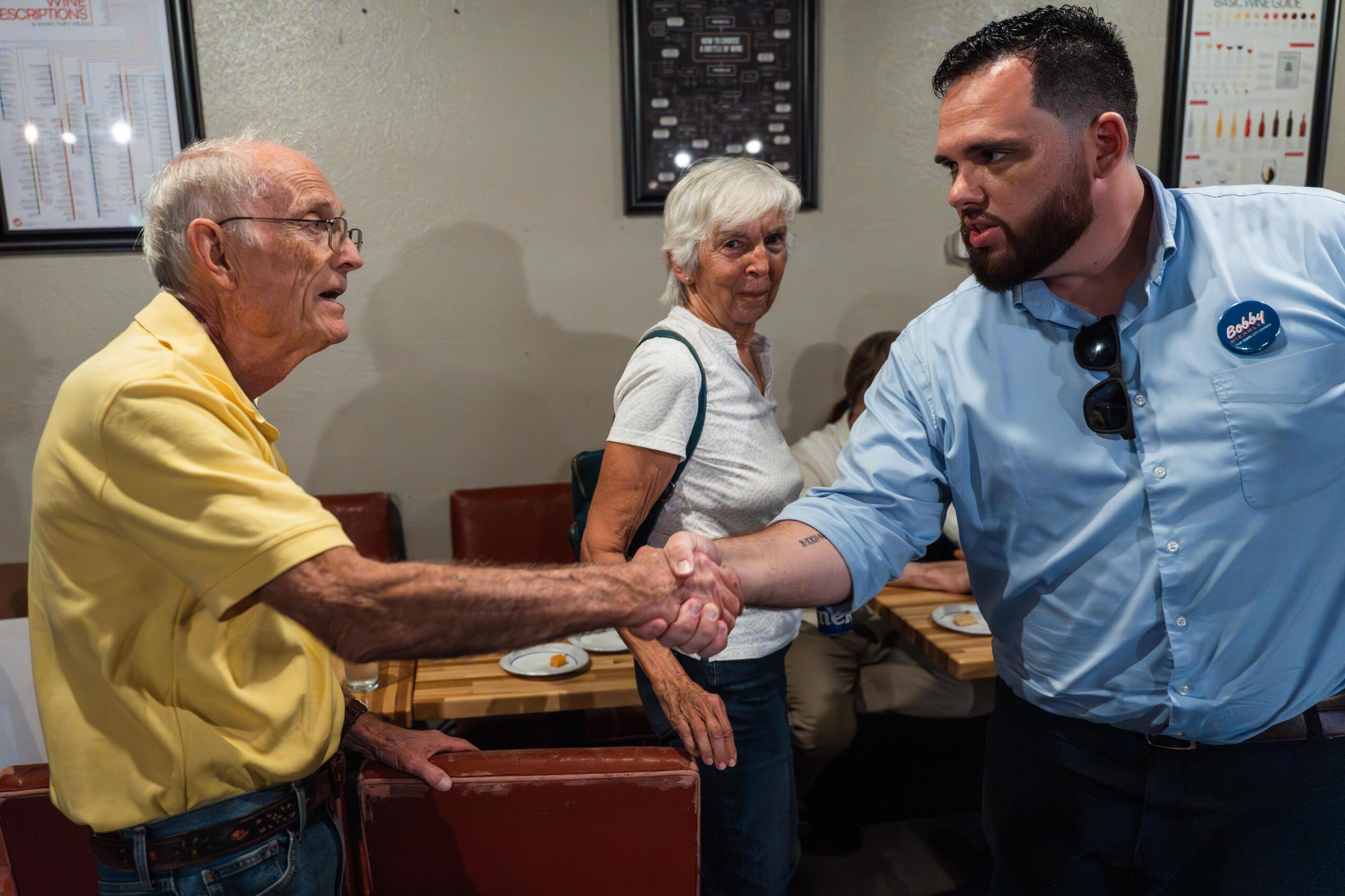 Bobby Nichols shaking the hand of a Tempe resident.