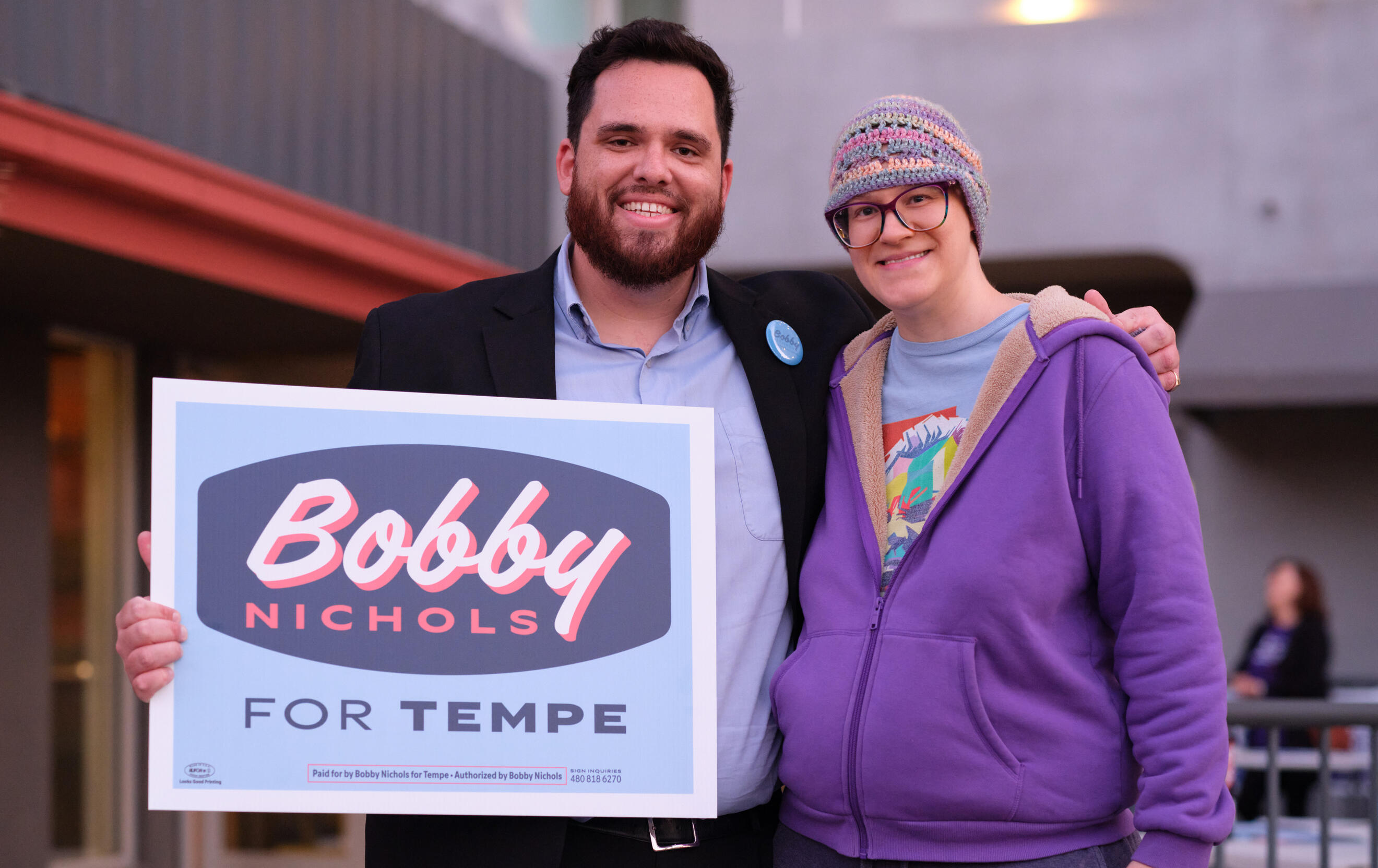 Bobby Nichols shaking the hand of a Tempe resident.